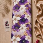 Elegant floral print featuring rich purple and ivory blossoms with soft golden foliage on a light lavender background- Italian Silk (ST01)