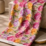tulip floral design in blush pink, fuchsia, lavender, golden yellow, orange, and olive green.