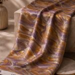 Abstract marble swirl design with metallic gold accents in lavender and amber tones-Italian Chiffon Zari (ZR16)