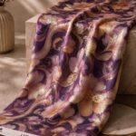 Elegant floral scroll design with metallic gold accents on a royal purple background-Italian Chiffon Zari (ZR16)
