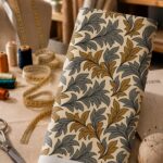Elegant ornamental leaf print with flowing gold and grey foliage.