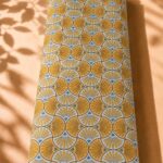 Geometric fan pattern in mustard yellow and white with a clean Art Deco-inspired design-Spanish Cotton (PC11)