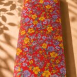 Delicate floral pattern in vibrant red with yellow and lavender blossoms-Spanish Cotton (PC11)
