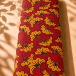 Bold floral pattern in rich red and mustard yellow with a modern botanical style-Spanish Cotton (PC11)