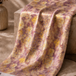 Lavender chiffon zari fabric featuring an abstract watercolor-inspired pattern with shimmering gold zari accents for a soft, artistic look-Italian Chiffon Zari (ZR16)