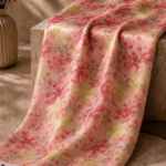 Blush pink chiffon zari fabric featuring elegant bow and floral motifs with shimmering gold accents for a graceful, feminine look-Italian Chiffon Zari (ZR16)