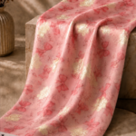 Pink chiffon zari fabric featuring delicate bow motifs with shimmering gold accents for a soft, feminine look-Italian Chiffon Zari (ZR16)