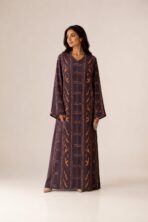 Deep plum abaya featuring elegant vertical patterns in warm orange and pink tones for a refined modern look