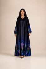 Elegant navy abaya featuring vibrant jellyfish-inspired prints along the hem and sleeves, with a smooth flowing silhouette