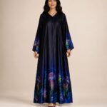 Elegant navy abaya featuring vibrant jellyfish-inspired prints along the hem and sleeves, with a smooth flowing silhouette