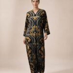 Black abaya featuring luxurious gold baroque-inspired motifs with intricate symmetrical detailing for an elegant statement look