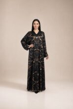 Black abaya featuring elegant chain and equestrian-inspired motifs in rich brown and gold tones, adding a luxurious and distinctive touch