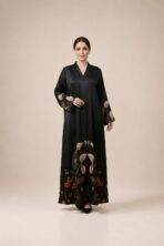 Black abaya featuring graceful floral detailing in warm beige and burnt orange tones, beautifully placed along the hem and sleeves.