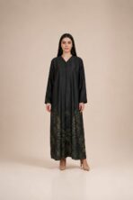 Elegant abaya featuring subtle botanical leaf motifs in deep olive and gold tones, beautifully concentrated along the lower hem.