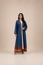 Rich blue open abaya featuring geometric borders in warm rust tones, complemented by a striking palm-inspired motif on the back