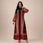 Open-front abaya featuring rich burgundy and beige tones, detailed with ornate borders and bold black floral accents
