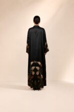 Black abaya featuring graceful floral detailing in warm beige and burnt orange tones, beautifully placed along the hem and sleeves. - Image 2