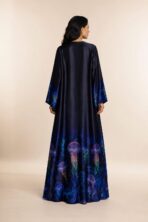Elegant navy abaya featuring vibrant jellyfish-inspired prints along the hem and sleeves, with a smooth flowing silhouette - Image 2