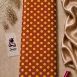 Retro-inspired yellow polka dot pattern on a warm rust-red background - Silk Jacquard (JD02)