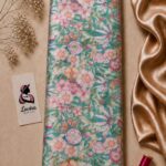 Romantic botanical design featuring soft pink and peach flowers with delicate butterflies and leafy details on a fresh turquoise background - Silk Jacquard (JD02)