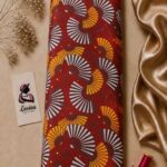 Japanese-inspired fan pattern in white, yellow, and orange on a deep red background - Silk Jacquard (JD02)