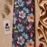 Vibrant multicolor floral pattern in pink, turquoise, blue, and peach tones on a deep navy background - Silk Jacquard (JD02)