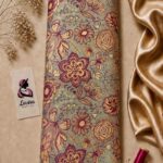 Silk jacquard with an elegant woven floral and butterfly pattern in burgundy and gold tones on a sage green base - Silk Jacquard (JD02)