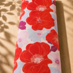 Contemporary floral pattern with striking scarlet blooms, outlined petal details, and soft pastel flowers for a playful artistic look - SWISS COTTON (PC01)