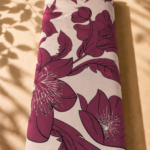 Elegant burgundy floral design with large blossoms and leaves on a soft ivory background - Spanish Cotton (PC11)
