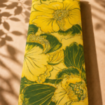 Bold yellow floral design with large flowers and deep green leaves - Spanish Cotton (PC11)