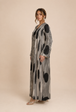 Striking black and white abaya featuring fine vertical stripes with bold oversized polka dots for a modern geometric look - Image 3