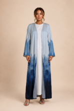 Elegant open abaya with a soft sky-blue to deep navy watercolor gradient and artistic brushstroke effect
