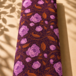 Deep burgundy chiffon with elegant pink florals and warm orange leafy vines - Italian Chiffon (CF01)