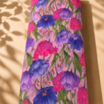 Soft pink chiffon adorned with vibrant fuchsia, violet, and royal blue florals with fresh green stems - Italian Chiffon (CF01)
