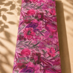 Soft pink chiffon adorned with expressive fuchsia, burgundy, and purple florals with subtle green accents - Italian Chiffon (CF01)