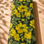 Deep green chiffon adorned with bold golden-yellow florals and lush olive green leaves - Italian Chiffon (CF01)