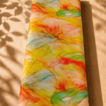 Bright yellow cotton with flowing abstract watercolor forms in coral, aqua, green, and soft blue - Italian Cotton (PC02)