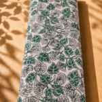 Ivory cotton with elegant deep green leaves and delicate black botanical florals - Italian Cotton (PC02)