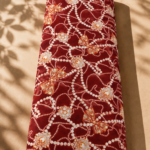 Deep burgundy cotton with luxurious pearl chains, jeweled floral ornaments, and elegant golden bow motifs - Italian Cotton (PC02)