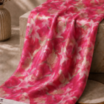 Striking fuchsia lilies blended with rich golden accents for a bold glamorous finish - Chiffon Zari (ZR16)