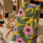Vibrant floral print with bold blooms and lush botanical leaves.