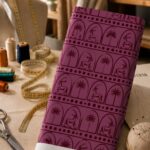 Rich burgundy geometric design featuring elegant gazelle and palm tree motifs framed within repeating arches, inspired by traditional Arabian heritage.