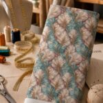 Elegant layered leaf-inspired forms in soft ivory and aqua blue, accented with subtle beige and blush tones for a refined artistic look.