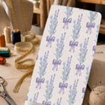 Delicate lavender bouquets tied with purple bows on a soft ivory background.