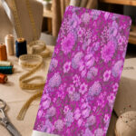 Vibrant magenta floral print with layered pink and lilac blossoms and tonal leaves.