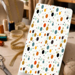 Playful multicolor polka-dot print on a clean white background.