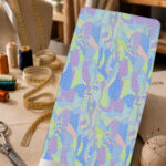 Soft pastel abstract print in sky blue, lavender, mint green, and blush pink.