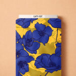Bold floral design featuring oversized deep royal-blue blossoms layered over a vibrant golden-yellow background.