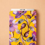 Vibrant floral design featuring soft purple and lilac blossoms with flowing burgundy and gray-green leaves over a bright golden-yellow background.