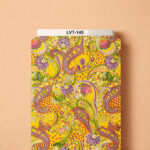 Vibrant paisley design featuring intricate ornamental motifs in pink, purple, orange, green, and ivory over a bright golden-yellow background.